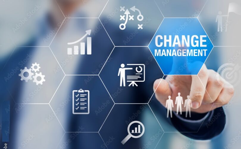 Change management in organization and business concept with consultant presenting icons of strategy, plan, implementation, communication, team, success.